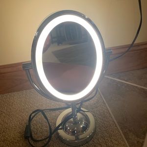 Magnifying lighted chrome vanity mirror